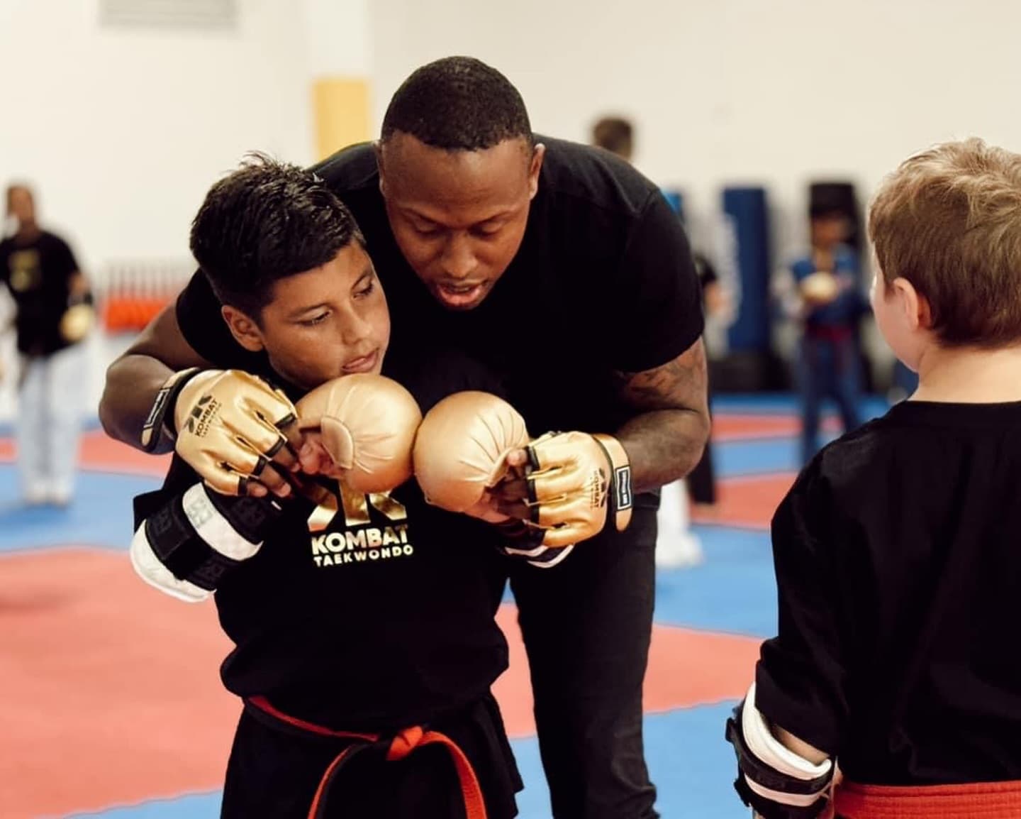 A coach leads a training class at Kombat Academy